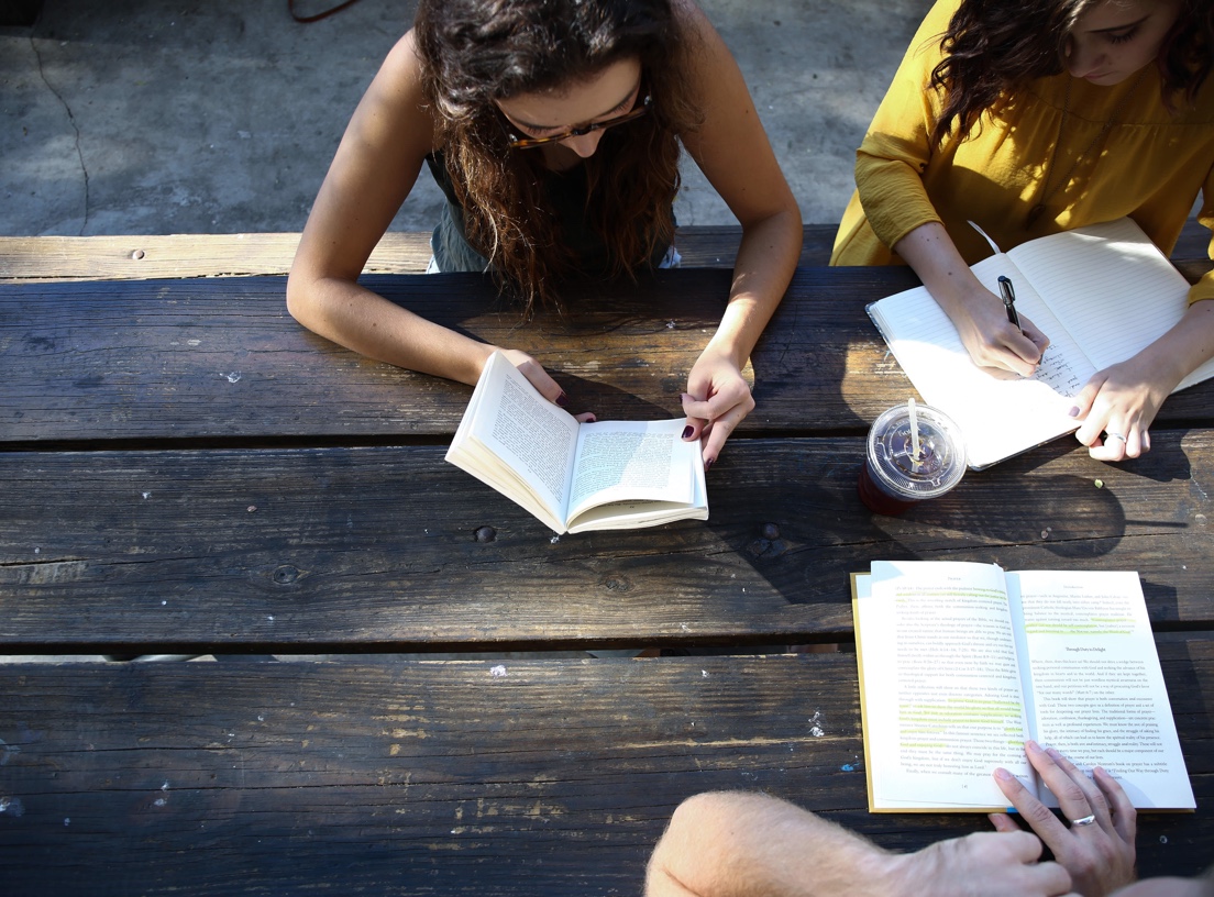 students studying at picnic table